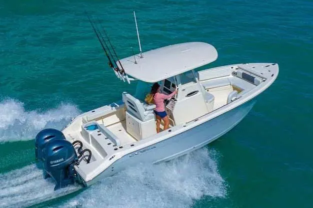 Slide: The Image of Manufacturer Provided Image: 2024 Cobia 240 Center Console boat cruising on the water. - 19