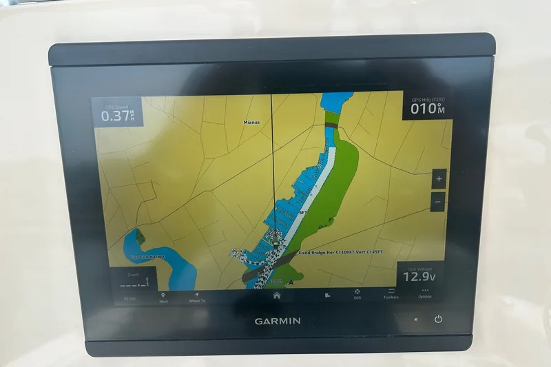 Slide: The Image of Garmin GPS display on 2024 Cobia 240 Center Console, showing navigation map and data. - 18
