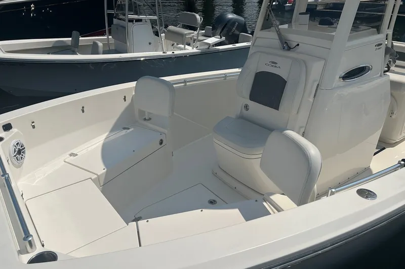 Slide: The Image of 2024 Cobia 240 Center Console boat interior with seating and storage compartments. - 4