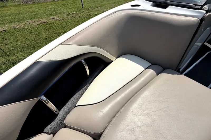 Slide: The Image of 2008 Malibu iRide boat interior with beige and white leather seating. - 36