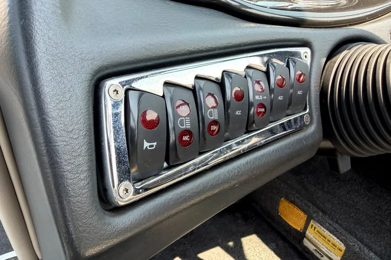 Slide: The Image of Dashboard control panel of a 2008 Malibu iRide with various switches and buttons. - 26