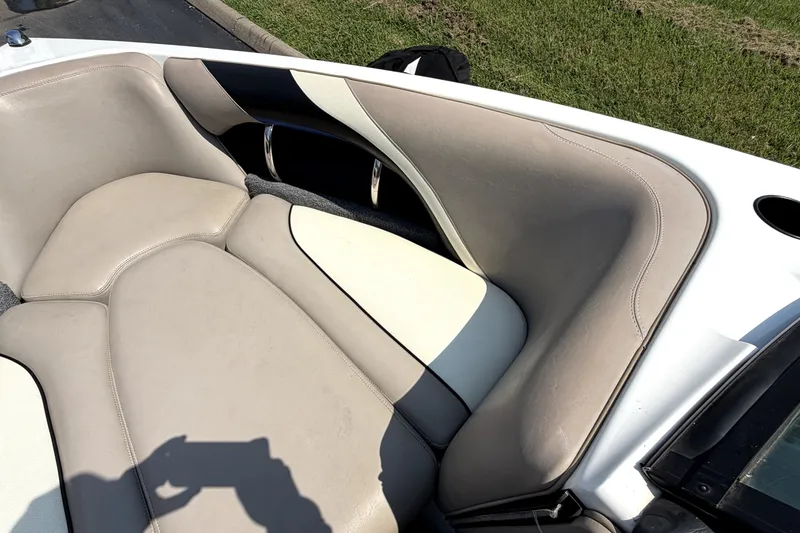 Slide: The Image of 2008 Malibu iRide boat interior with beige and white leather seating. - 34