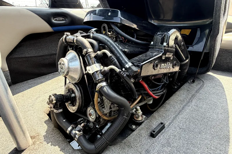 Slide: The Image of 2008 Malibu iRide boat engine, detailed view of components and hoses. - 40