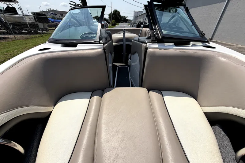 Slide: The Image of Interior view of a 2008 Malibu iRide boat with beige seating and open windshield. - 38