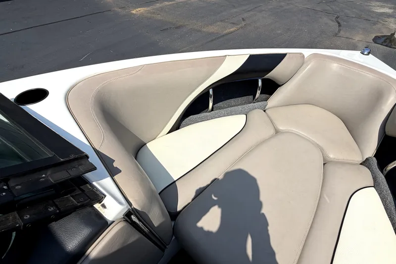Slide: The Image of 2008 Malibu iRide boat interior with beige and white cushioned seating. - 35