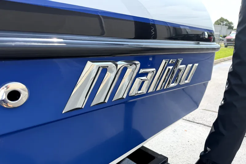 Slide: The Image of Close-up of 2008 Malibu iRide boat logo on blue exterior. - 6