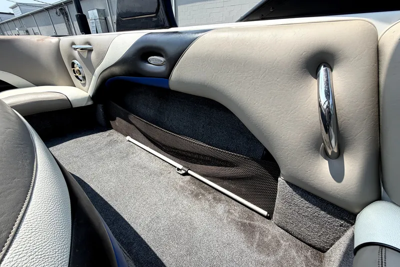 Slide: The Image of Interior of a 2008 Malibu iRide boat, featuring sleek upholstery and modern design elements. - 19