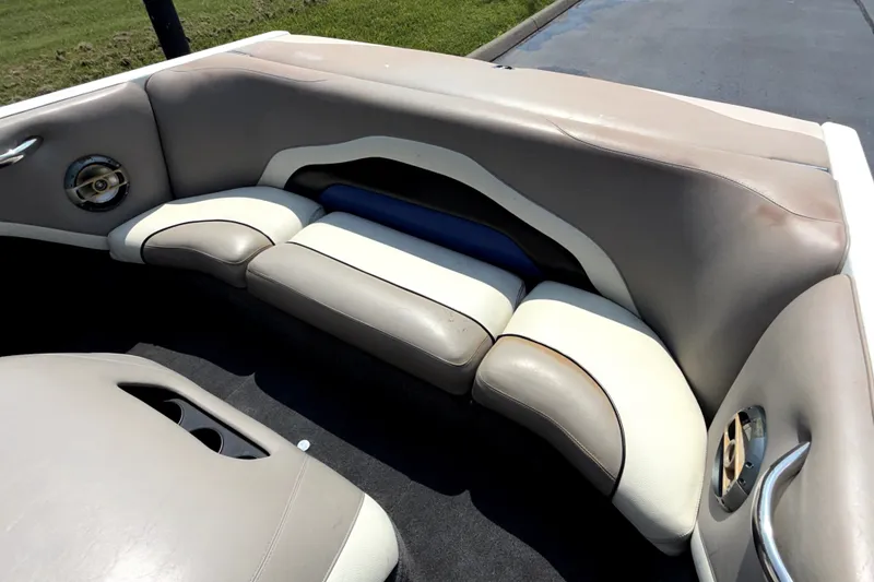 Slide: The Image of 2008 Malibu iRide boat interior with beige and white cushioned seating. - 15
