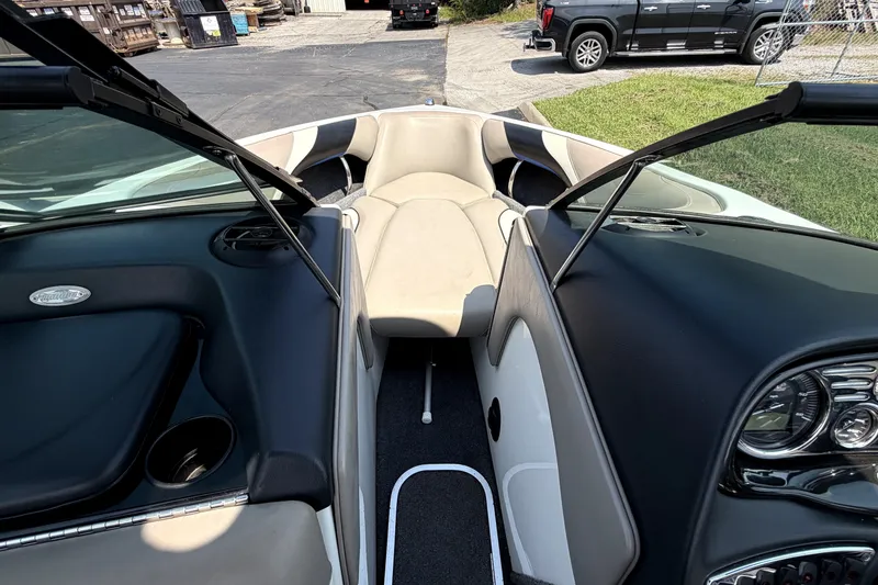 Slide: The Image of Interior view of a 2008 Malibu iRide boat, showcasing seating and dashboard details. - 31