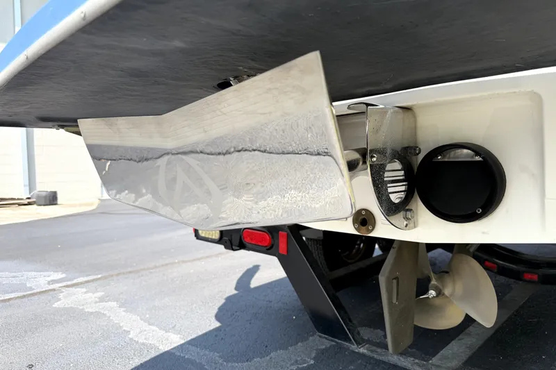 Slide: The Image of Rear view of a 2008 Malibu iRide boat showing propeller and exhaust system. - 41
