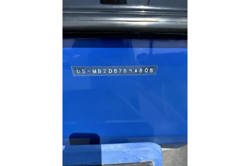 Slide: The Image of VIN plate on a 2008 Malibu iRide, displaying serial number on blue background. - 44