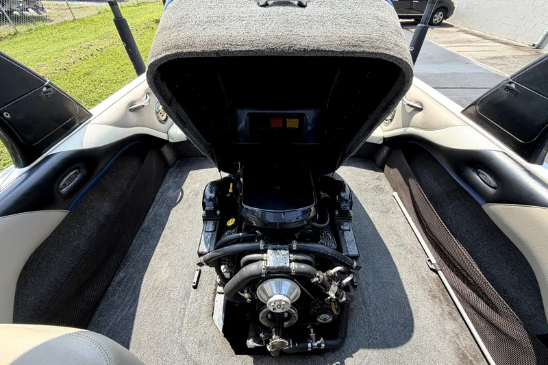 Slide: The Image of 2008 Malibu iRide boat engine compartment with open cover, showcasing interior mechanics. - 39