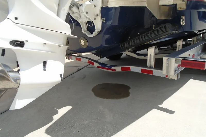 Slide: The Image of 2024 Regal LX9 boat on trailer, showing hull and propeller details. - 29