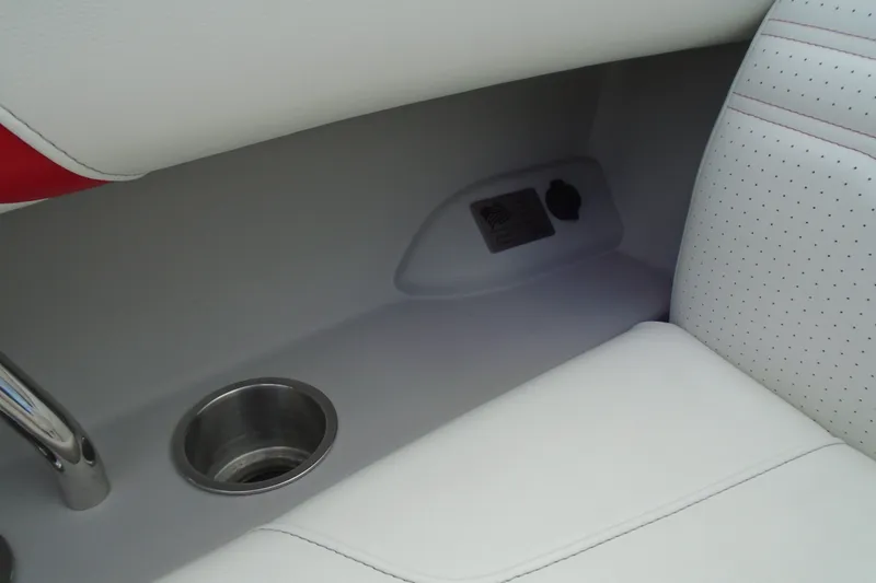 Slide: The Image of 2024 Regal LX9 interior detail with cup holder and white perforated seating. - 14