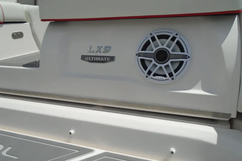 Slide: The Image of 2024 Regal LX9 boat with JL Audio speaker and Ultimate badge. - 32