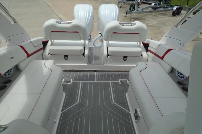 Slide: The Image of 2024 Regal LX9 boat interior with white seating and red accents, showcasing luxury design. - 11
