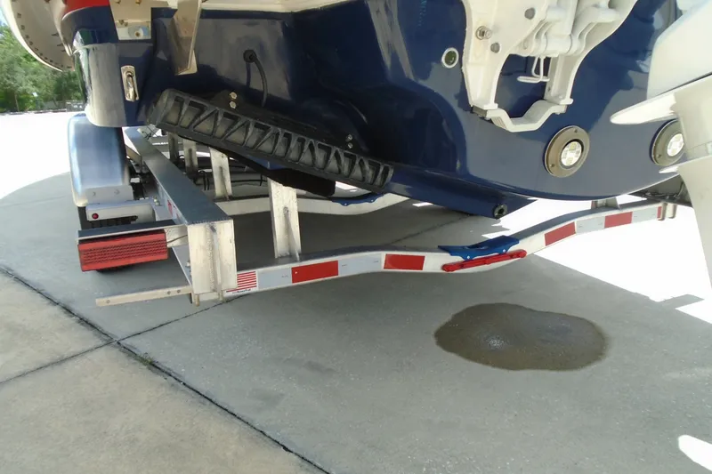 Slide: The Image of 2024 Regal LX9 boat on trailer, rear view, showing hull and trailer details. - 30