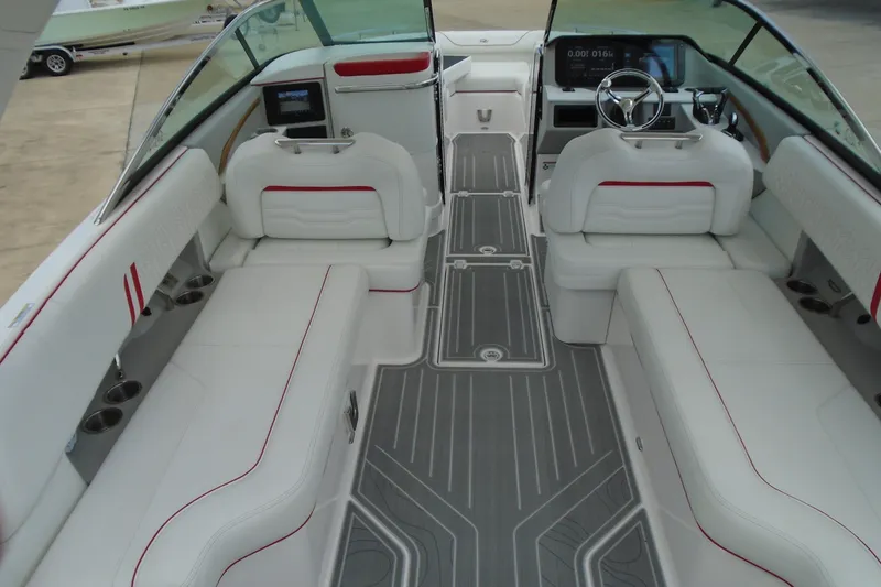 Slide: The Image of Luxurious interior of 2024 Regal LX9 boat with white seating and modern dashboard. - 22