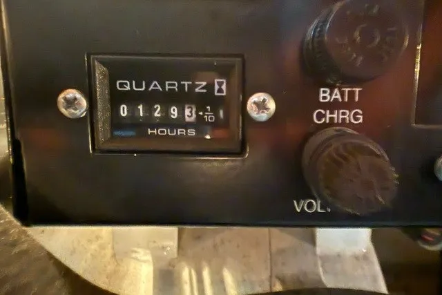 Slide: The Image of Hour meter reading 1293.1 on a 2005 Formula 370 Super Sport boat dashboard. - 9