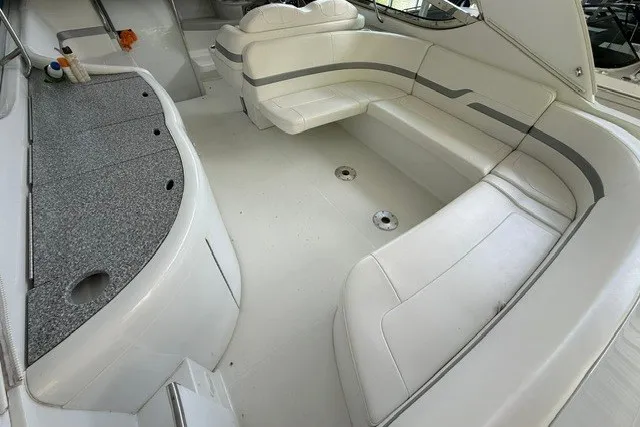Slide: The Image of 2005 Formula 370 Super Sport boat interior with white seating and sleek design. - 20