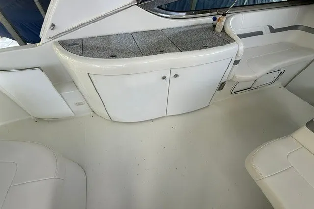 Slide: The Image of 2005 Formula 370 Super Sport boat interior with white cabinetry and seating. - 17