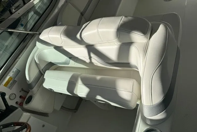 Slide: The Image of 2005 Formula 370 Super Sport boat interior with white leather seating. - 34