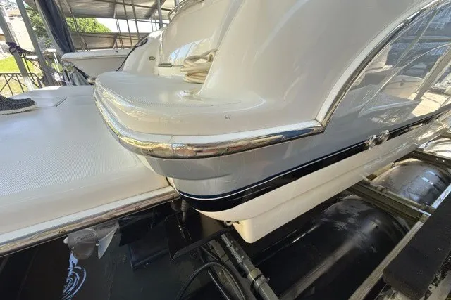 Slide: The Image of 2005 Formula 370 Super Sport boat in a marina, showcasing sleek design and chrome accents. - 25