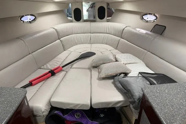 Slide: The Image of Interior of 2005 Formula 370 Super Sport boat with cushioned seating and paddles. - 32