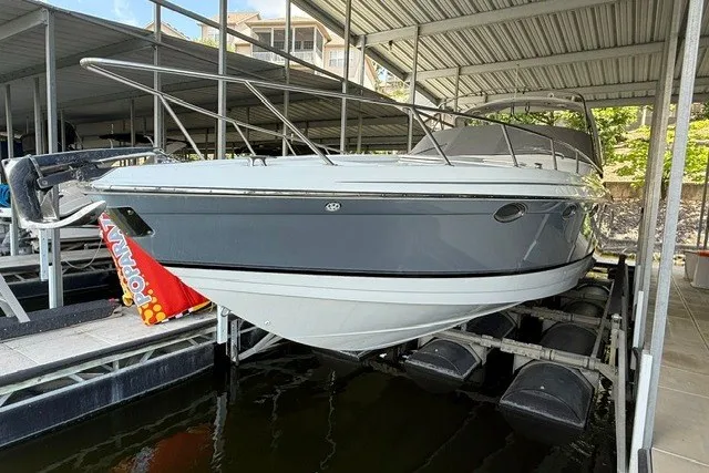 Slide: The Image of 2005 Formula 370 Super Sport boat docked in a covered marina. - 5