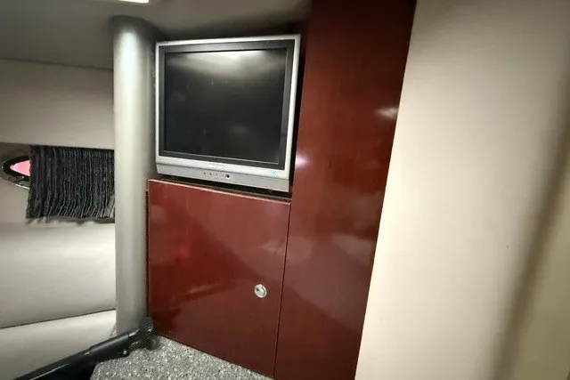 Slide: The Image of 2005 Formula 370 Super Sport interior with TV and wooden cabinet. - 13
