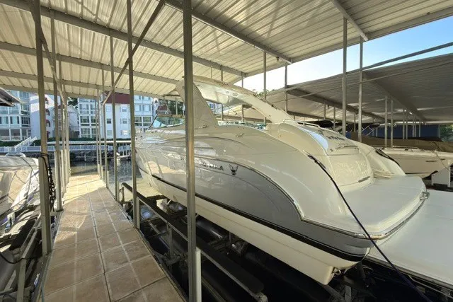 The Image of 2005 Formula 370 Super Sport boat docked under covered marina. - 26