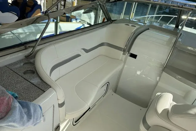 Slide: The Image of 2005 Formula 370 Super Sport boat interior with white seating and sleek design. - 35