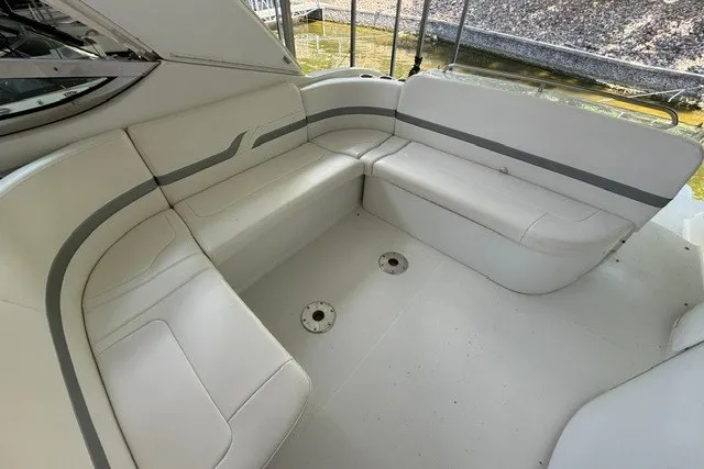 Slide: The Image of 2005 Formula 370 Super Sport boat interior with white seating and sleek design. - 18