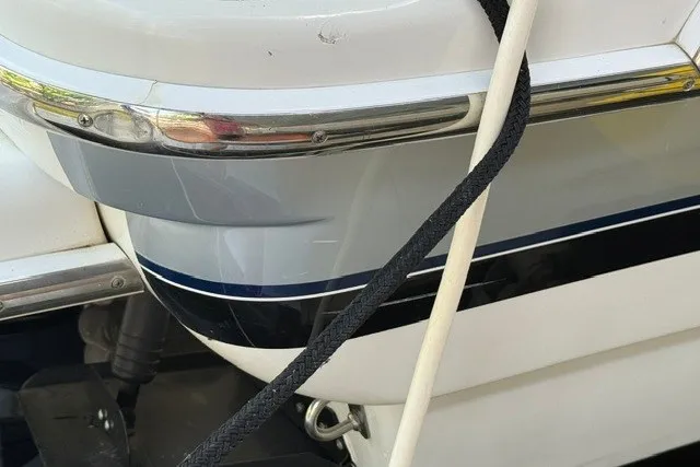 Slide: The Image of Close-up of a 2005 Formula 370 Super Sport boat with ropes and chrome detailing. - 23