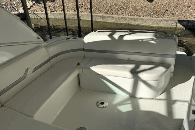 Slide: The Image of 2005 Formula 370 Super Sport boat interior with white seating and shadow patterns. - 37