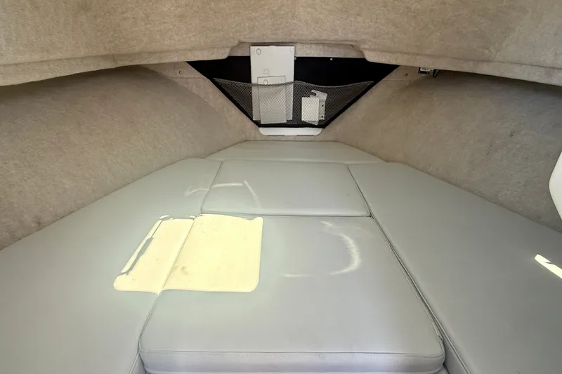 Slide: The Image of Interior cabin of 2022 Parker 2520 XLD Sport Cabin with cushioned seating. - 11