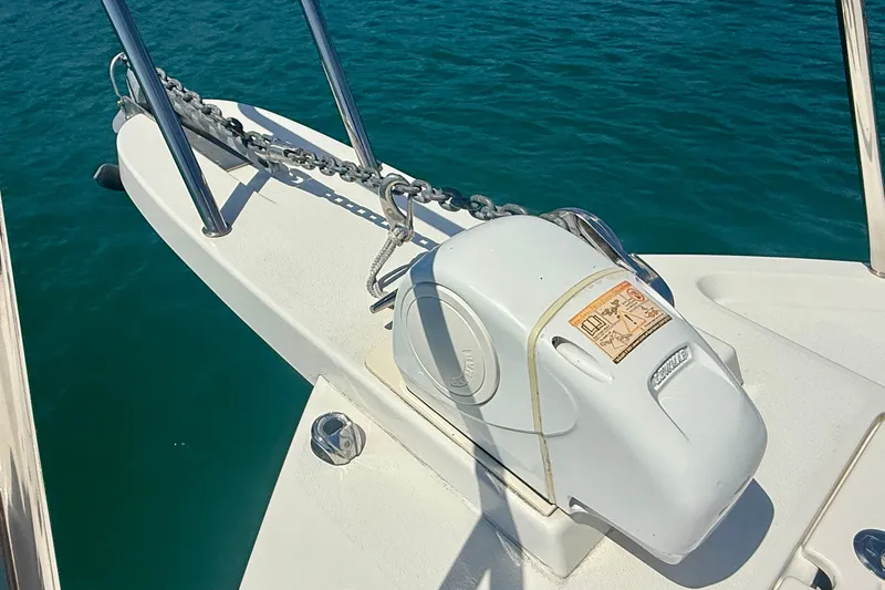 Slide: The Image of Anchor system on 2022 Parker 2520 XLD Sport Cabin boat, floating on clear blue water. - 26