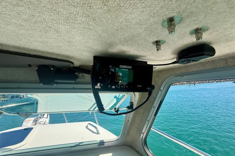 Slide: The Image of Interior view of 2022 Parker 2520 XLD Sport Cabin with Simrad marine electronics. - 37