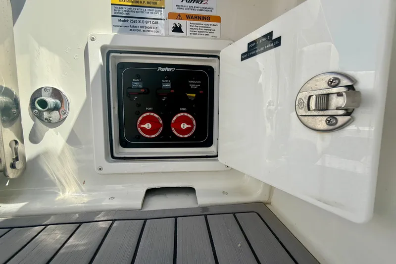 Slide: The Image of Control panel inside a 2022 Parker 2520 XLD Sport Cabin boat. - 23