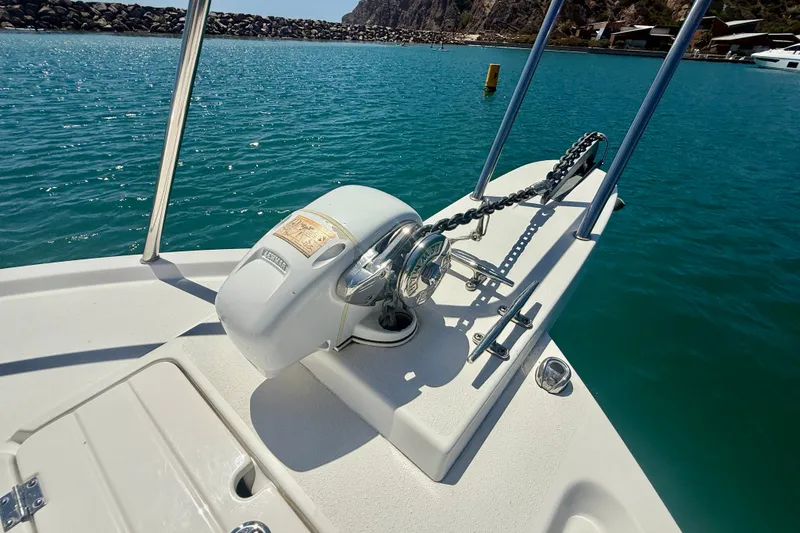 Slide: The Image of 2022 Parker 2520 XLD Sport Cabin boat anchor system on calm blue water. - 25