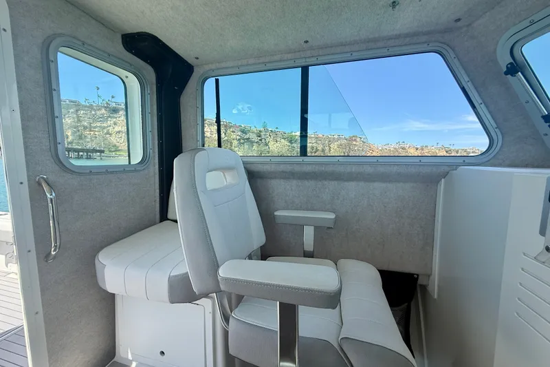 Slide: The Image of Interior of 2022 Parker 2520 XLD Sport Cabin with seating and large windows. - 39