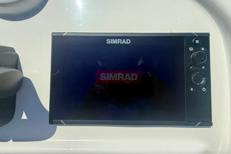 Slide: The Image of Simrad navigation system on 2022 Parker 2520 XLD Sport Cabin boat dashboard. - 30