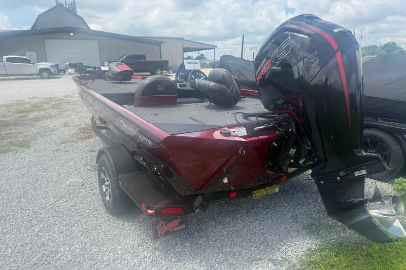 Slide: The Image of 2018 Ranger RT188 boat with powerful engine, parked on gravel lot. - 6