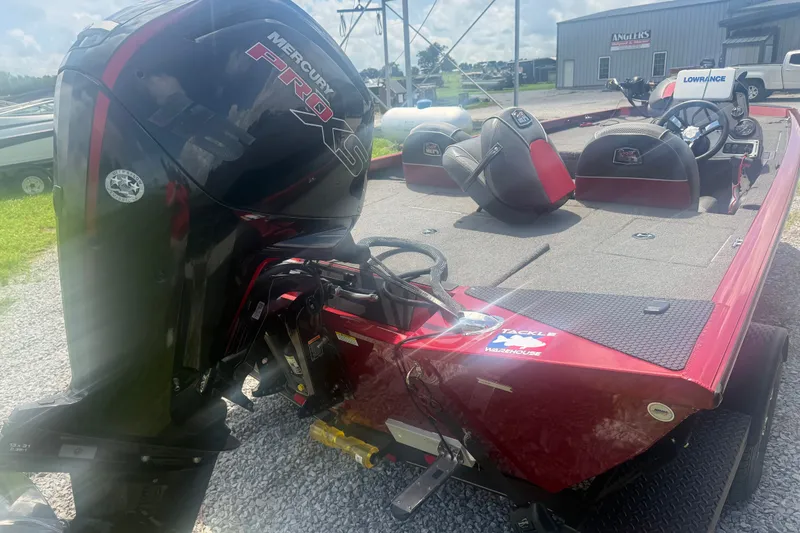 Slide: The Image of 2018 Ranger RT188 boat with Mercury Pro XS engine, parked outdoors on gravel. - 7