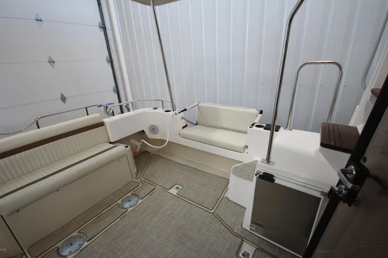 Slide: The Image of 2026 Ranger Tugs R-31 CB boat interior with seating and storage compartments. - 11