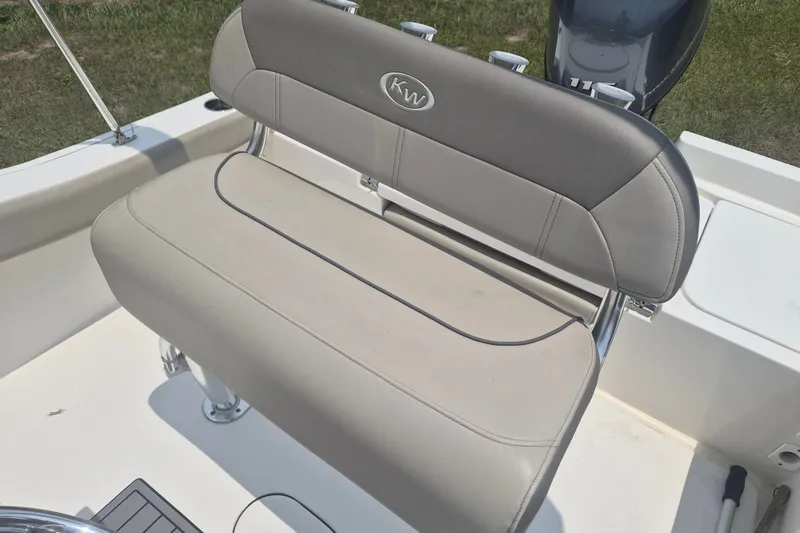 Slide: The Image of 2024 Key West 179 FS boat seat with gray upholstery and KW logo. - 11