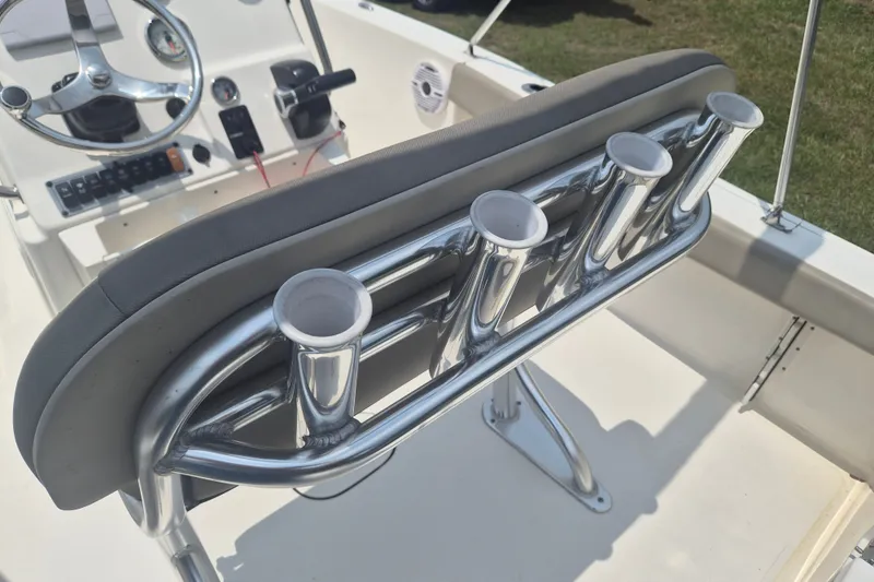 Slide: The Image of 2024 Key West 179 FS boat interior with rod holders and steering console. - 9