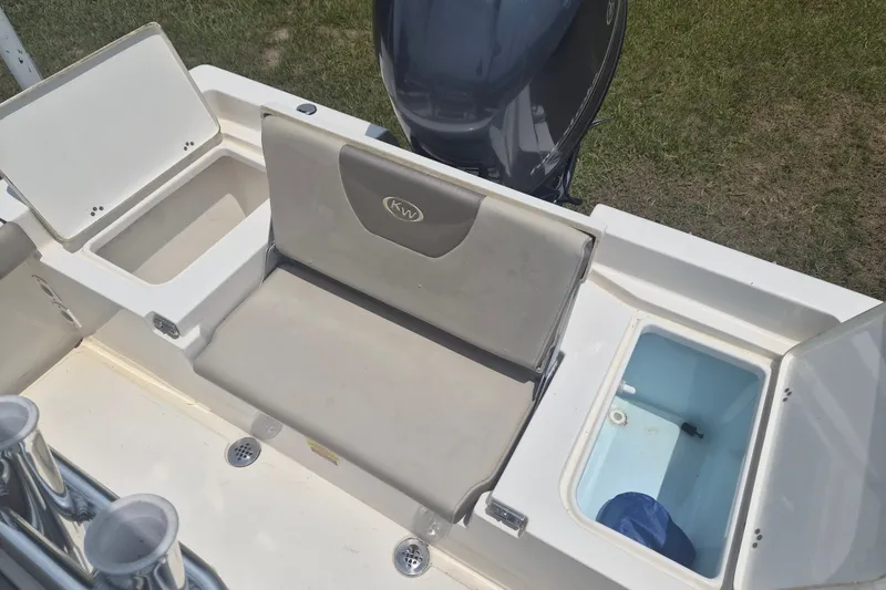Slide: The Image of 2024 Key West 179 FS boat interior with storage compartments and seating. - 6