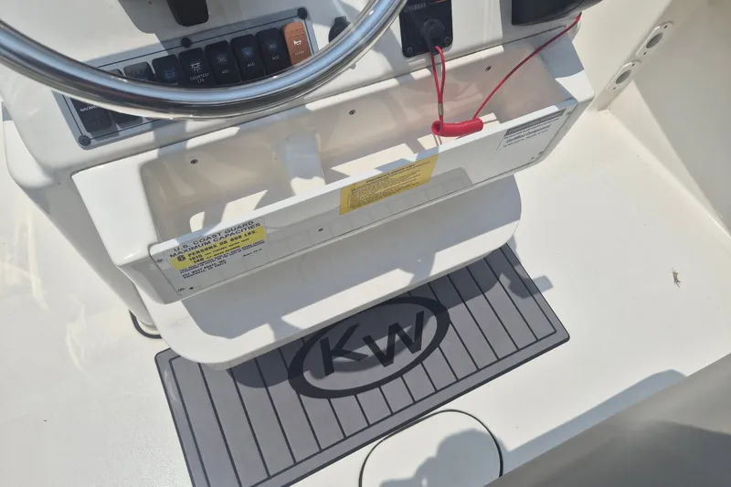Slide: The Image of 2024 Key West 179 FS boat console with steering wheel and control panel. - 12