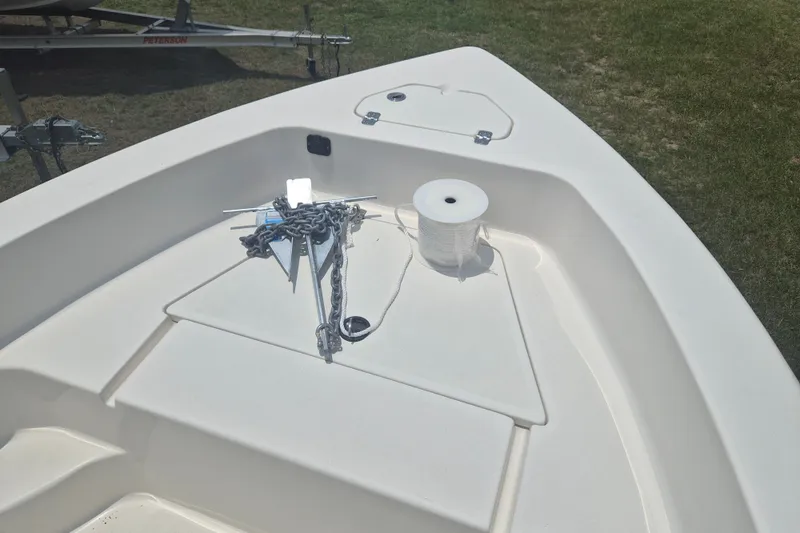 Slide: The Image of 2024 Key West 179 FS boat deck with anchor and rope on grass. - 18
